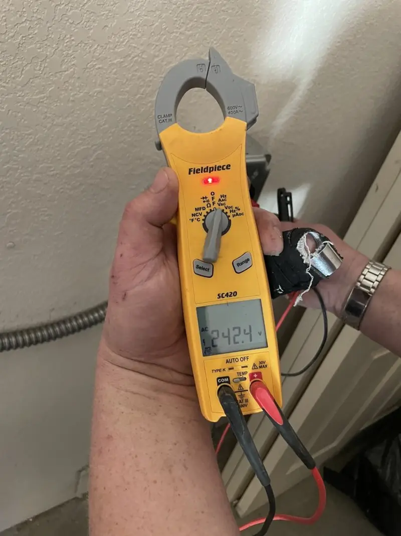 Voltage testing with clamp meter during Ceiling Fan Installation in Carson